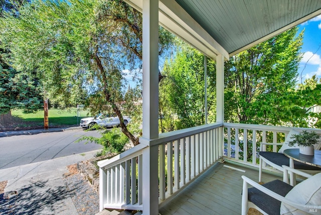 wooden deck featuring covered porch