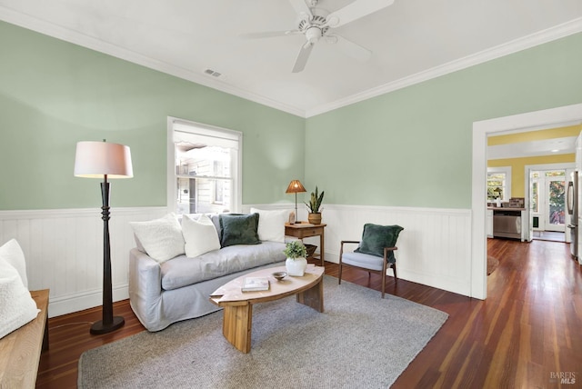 living room featuring ornamental molding, dark hardwood / wood-style floors, and ceiling fan