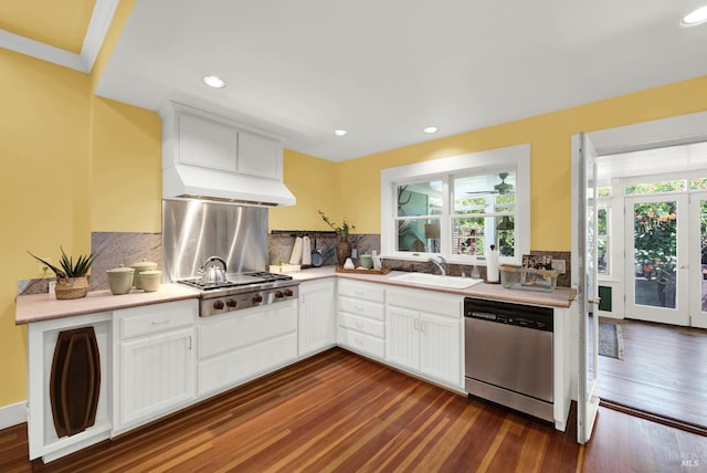 kitchen featuring white cabinetry, sink, tasteful backsplash, and stainless steel appliances