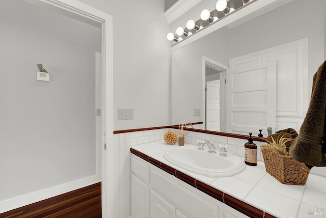 bathroom with vanity and hardwood / wood-style floors