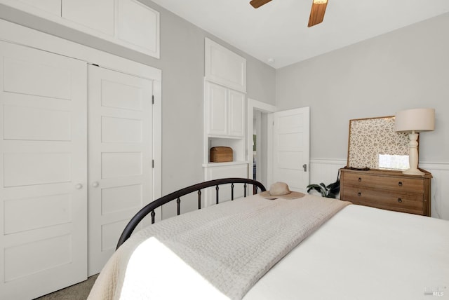 bedroom featuring ceiling fan and a closet