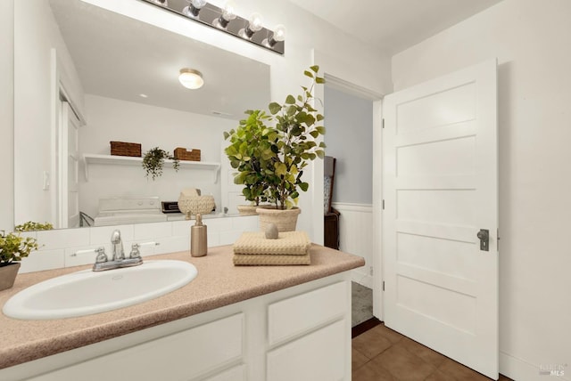 bathroom featuring tile patterned flooring and vanity