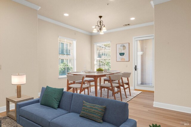 1120 Sonata Dr, Vallejo, CA 94591 - living room featuring light wood finished floors, baseboards, a chandelier, crown molding, and recessed lighting