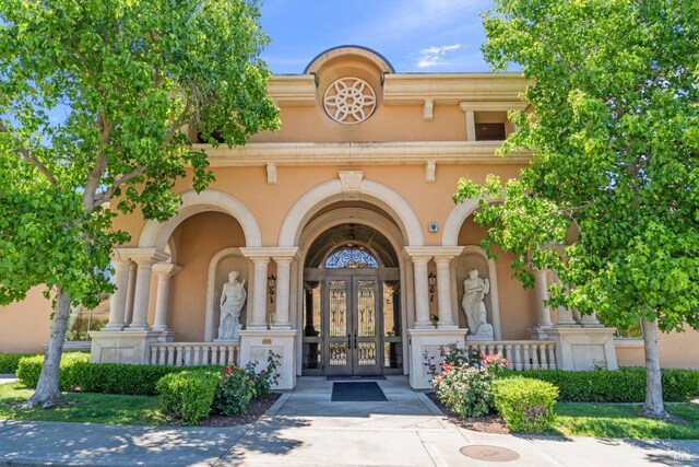 1120 Sonata Dr, Vallejo, CA 94591 - doorway to property with french doors, stucco siding, and a porch