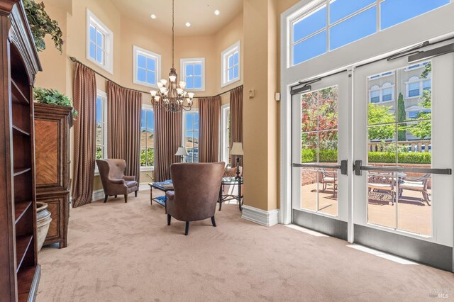 1120 Sonata Dr, Vallejo, CA 94591 - living area featuring a chandelier, carpet flooring, a towering ceiling, recessed lighting, and baseboards