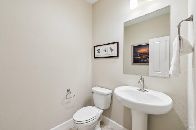 bathroom with toilet and sink