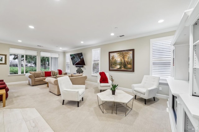 living room with light carpet and ornamental molding