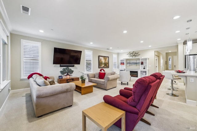 carpeted living room with crown molding