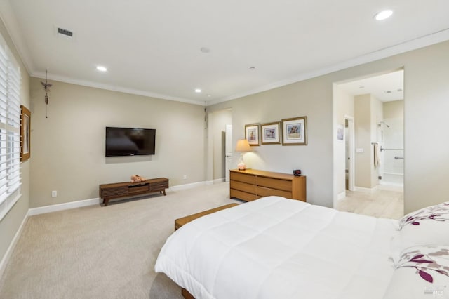 bedroom with crown molding, light colored carpet, and connected bathroom