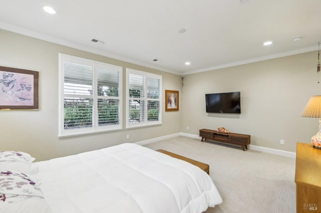 bedroom featuring ornamental molding and light colored carpet