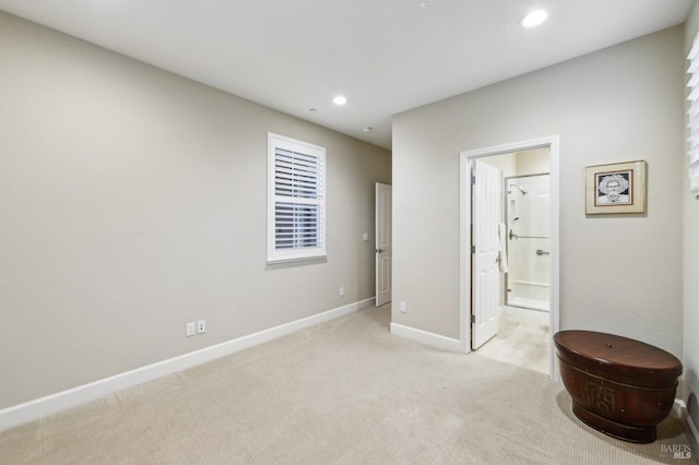 carpeted bedroom with ensuite bathroom