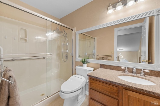 bathroom featuring vanity, toilet, and walk in shower