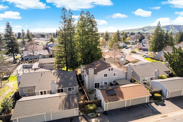 drone / aerial view featuring a mountain view