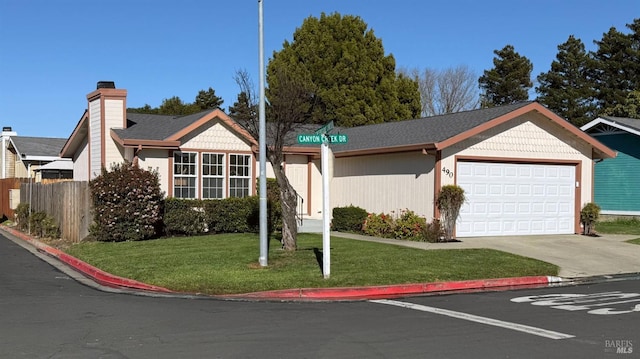 single story home featuring a garage and a front lawn