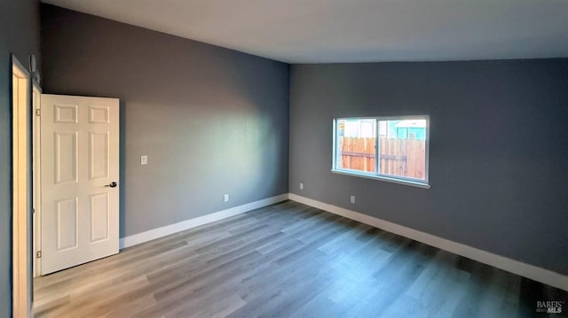 empty room featuring wood-type flooring