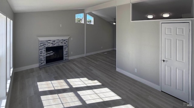 unfurnished living room featuring ceiling fan, dark hardwood / wood-style floors, and vaulted ceiling with beams