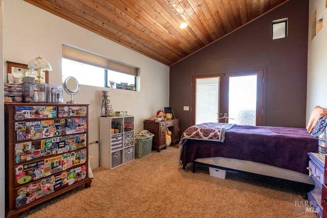 carpeted bedroom featuring lofted ceiling and wood ceiling