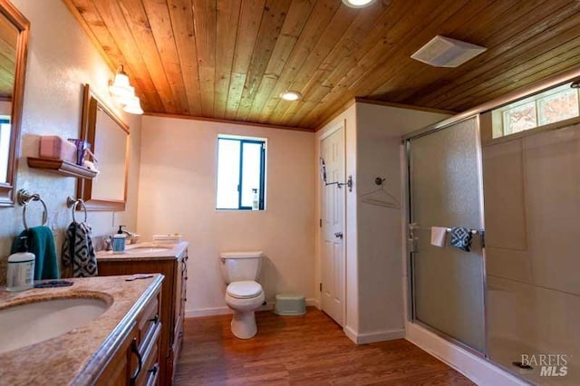 full bathroom featuring a sink, a stall shower, wood finished floors, and wood ceiling