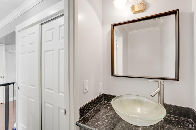 bathroom featuring vanity and crown molding