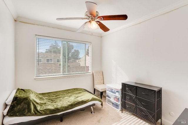 bedroom with ornamental molding and ceiling fan