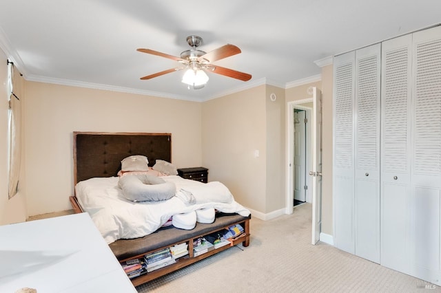 carpeted bedroom featuring ornamental molding and ceiling fan