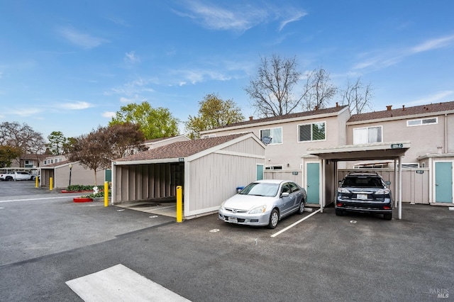 view of parking with a carport