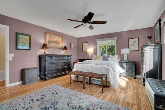 bedroom with ceiling fan and light wood-type flooring