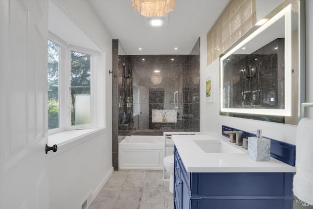 full bathroom featuring vanity, toilet, and separate shower and tub