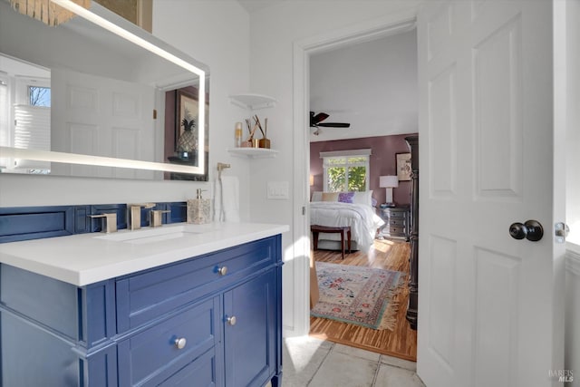 bathroom featuring vanity, wood-type flooring, and ceiling fan