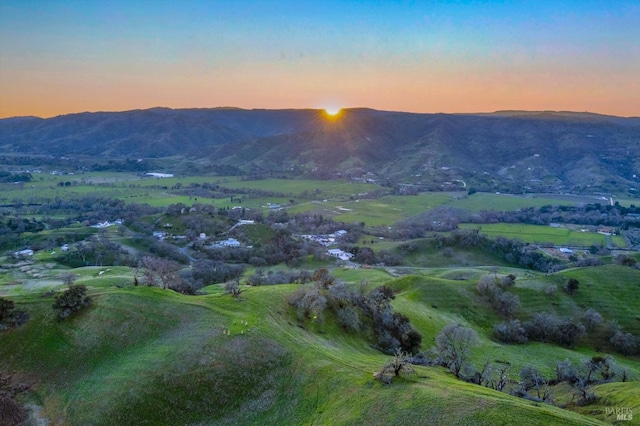 aerial view at dusk with a mountain view