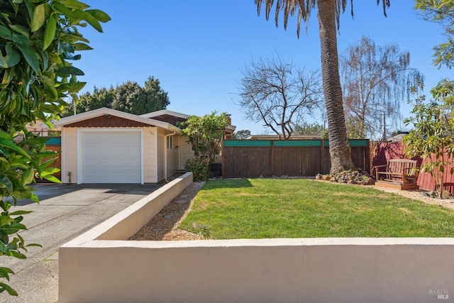 view of front of property with a garage and a front yard