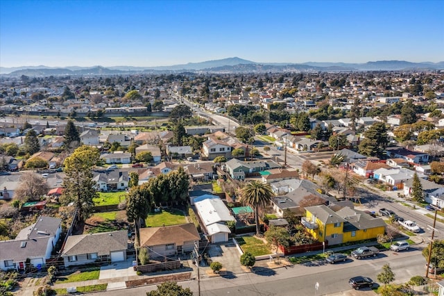 drone / aerial view featuring a residential view and a mountain view