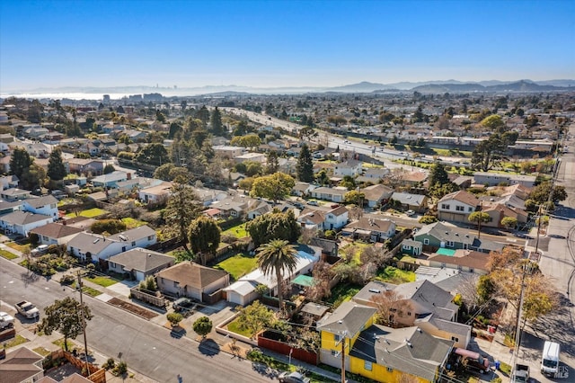 drone / aerial view with a residential view and a mountain view