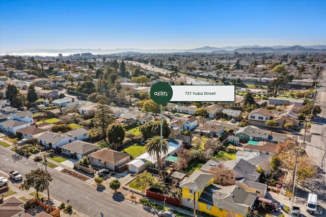 bird's eye view featuring a residential view and a mountain view