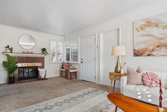 sitting room featuring a brick fireplace, ornamental molding, and carpet flooring