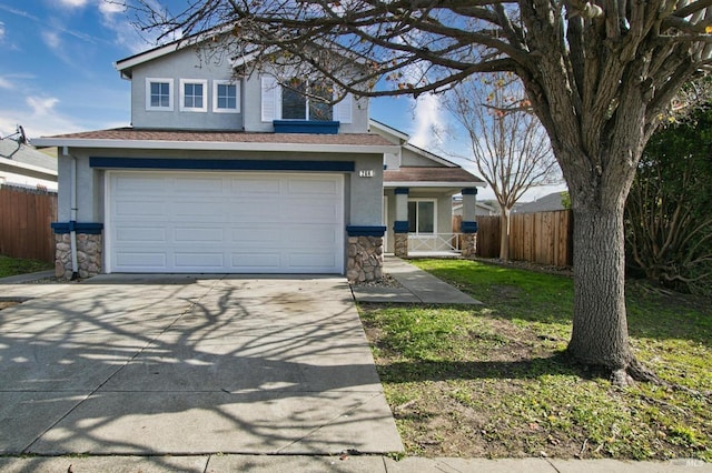 view of front property with a garage and a front lawn