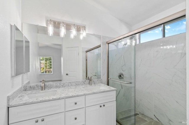 bathroom featuring vanity, lofted ceiling, a wealth of natural light, and an enclosed shower