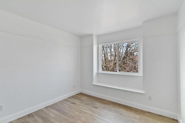 unfurnished room with light hardwood / wood-style flooring