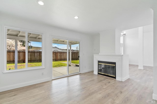 unfurnished living room featuring light wood-type flooring