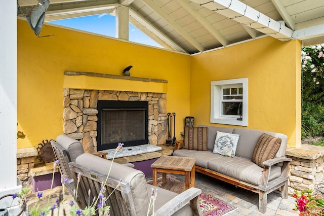 view of patio / terrace featuring an outdoor stone fireplace