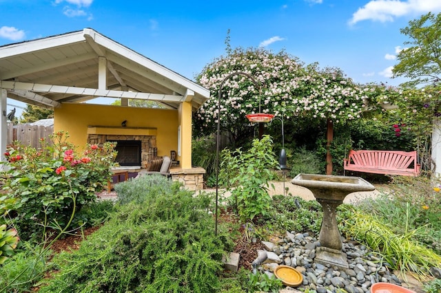 view of patio / terrace with an outdoor stone fireplace