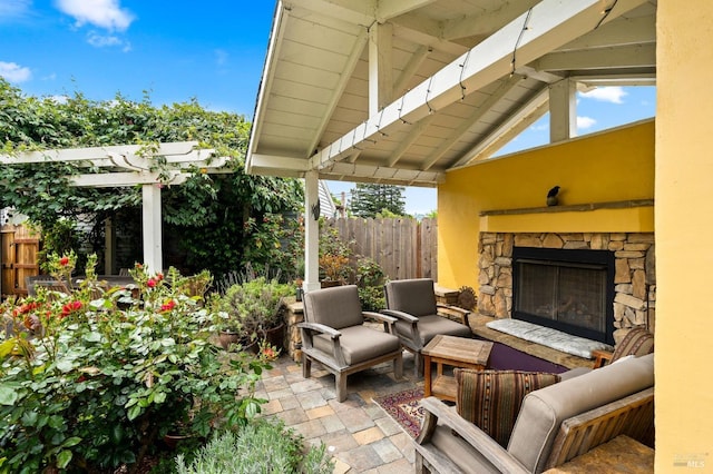 view of patio / terrace with an outdoor living space with a fireplace