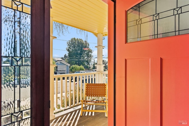 doorway to outside featuring plenty of natural light and hardwood / wood-style floors