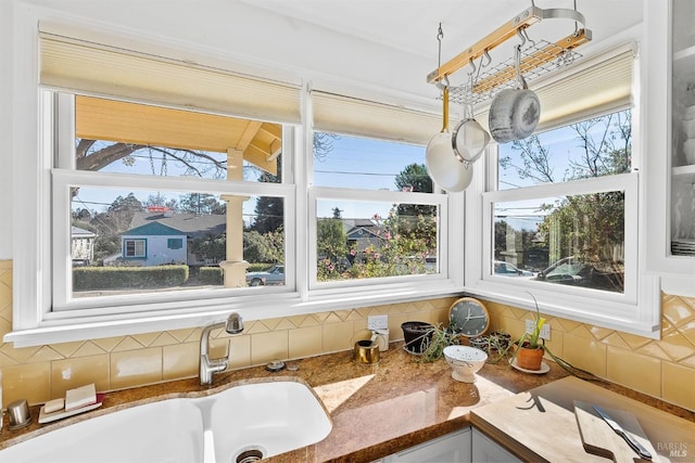 room details featuring tasteful backsplash and sink