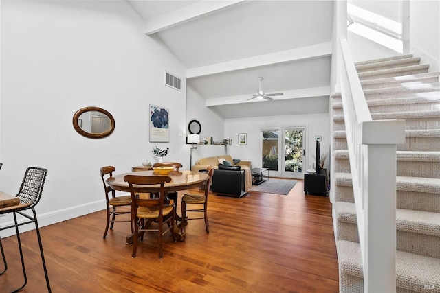 dining room featuring ceiling fan, high vaulted ceiling, beam ceiling, and hardwood / wood-style floors