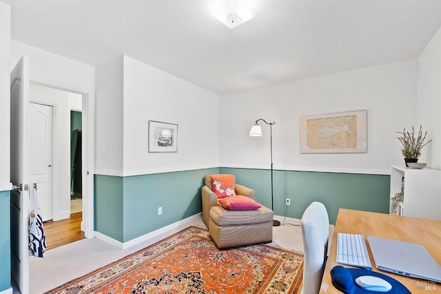 sitting room with carpet floors