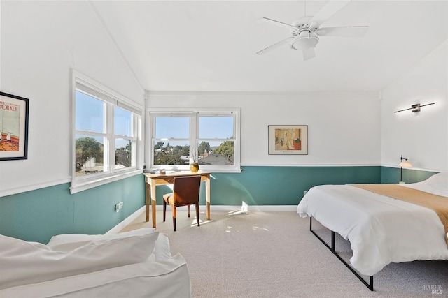 bedroom featuring carpet, lofted ceiling, and ceiling fan