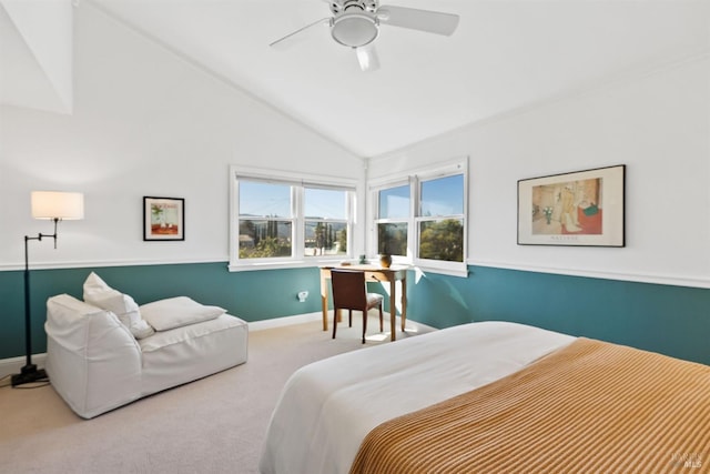 carpeted bedroom with vaulted ceiling and ceiling fan