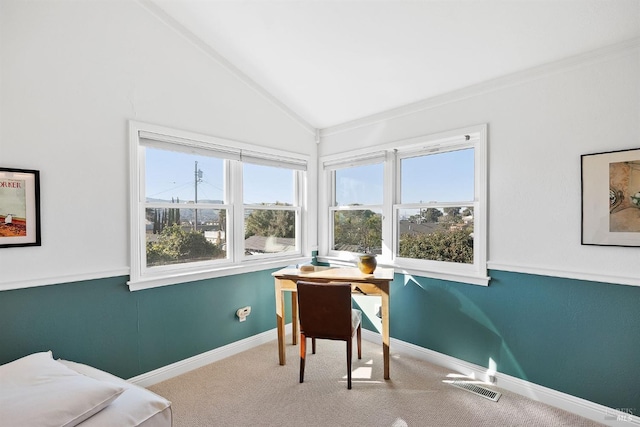 carpeted office space featuring vaulted ceiling and ornamental molding