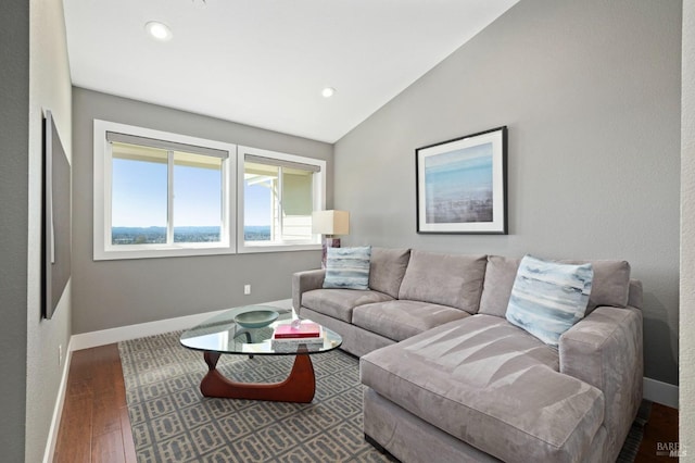 living room featuring wood finished floors, vaulted ceiling, baseboards, and recessed lighting